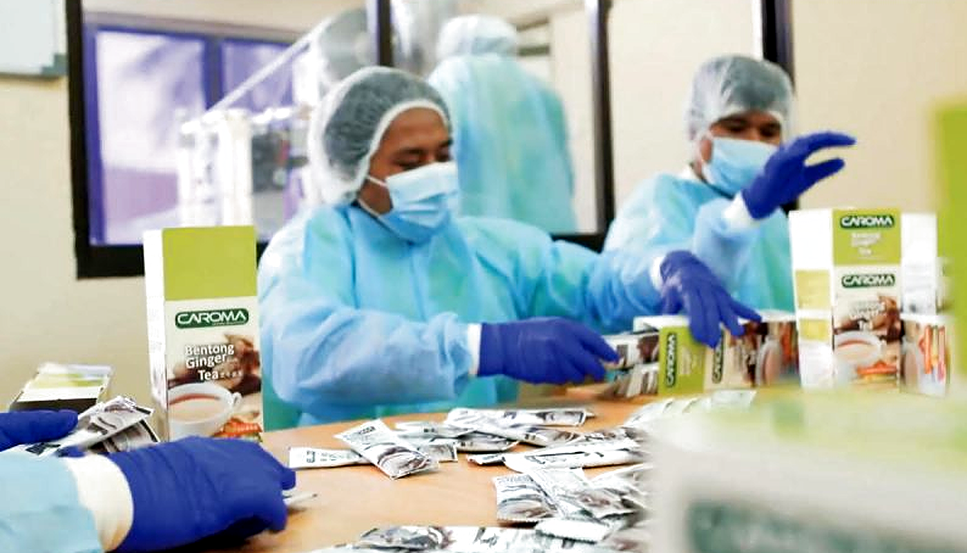 CAROMA beverage packaging and quality control process at Malaysia manufacturing facility